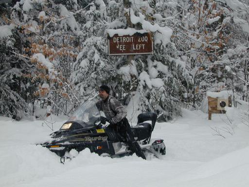 Matt working on the path with the snowmobile he rented.