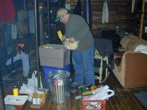 Jon sorting food to leave in the can.