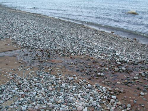 Stream on beach created by runoff from the dunes.