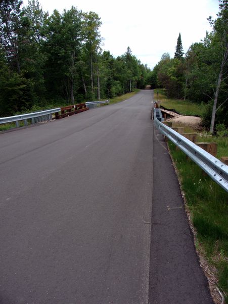 The paved road over the bridge.