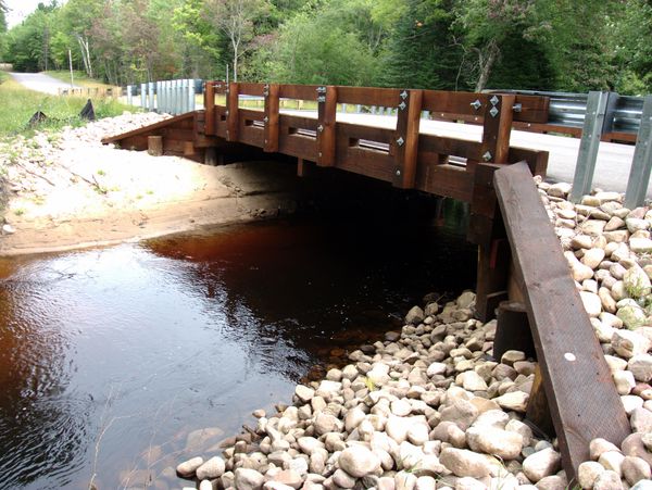 View of the river running under the bridge.