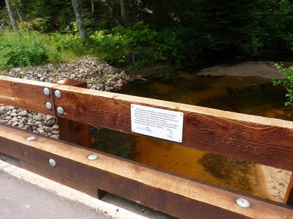 Sign on the fancy bridge along Old Seney.