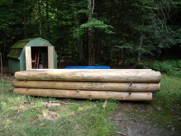 New logs waiting to be rebuild the wall.