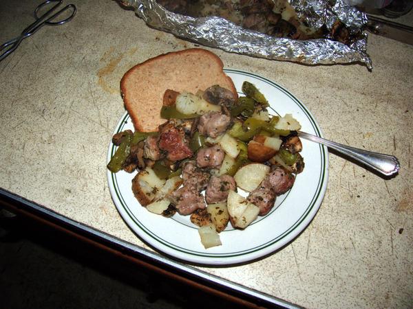 Foil pack dinner of sausage and vegetables ready to be eaten!