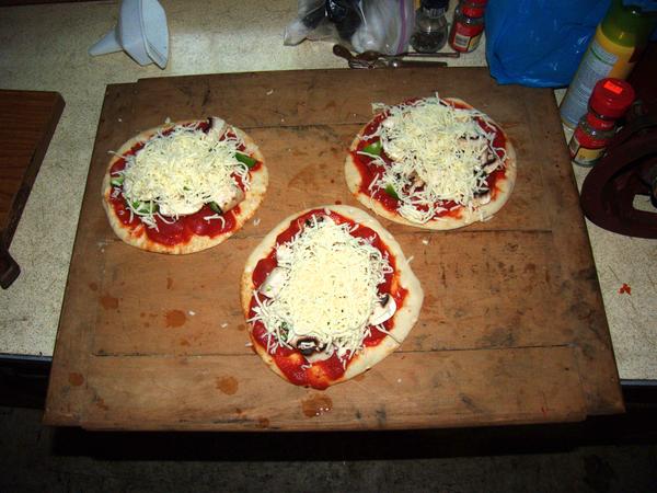 Pita bread pizzas ready to be cooked.