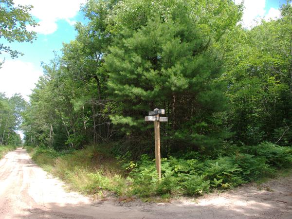 Street sign for the Whitewash road - Airport road intersection.