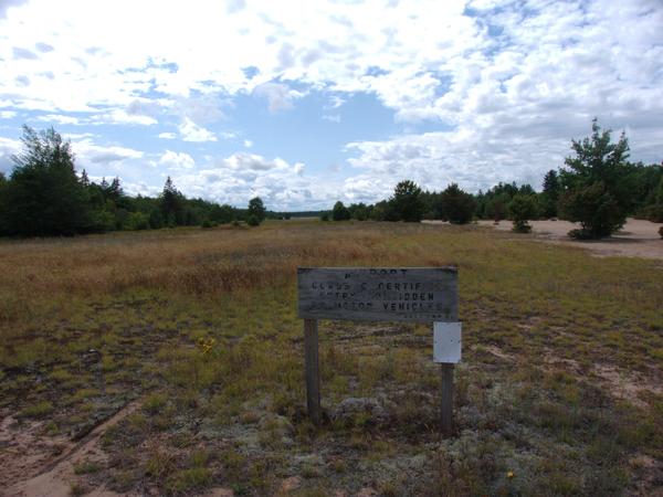 Close up of sign on the edge of Grand Marais airport.