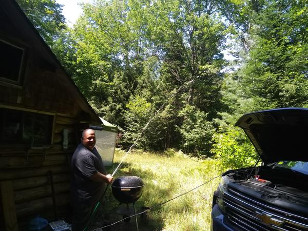 Jon showing there is water in the well! We hooked an electric pump out and pulled out a lot of water until it cleared.