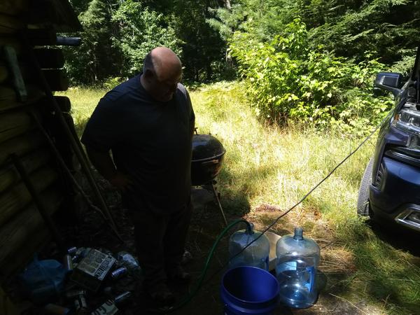 Jon watching as we filled water jugs from the well.