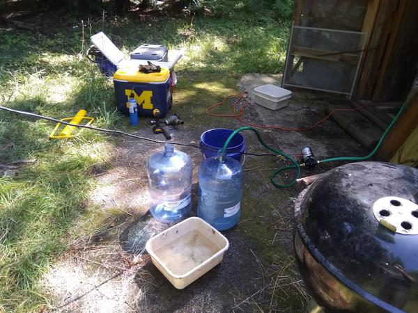 Filling water jugs from the well.
