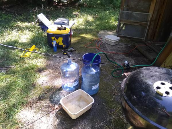 Filling water jugs from the well.