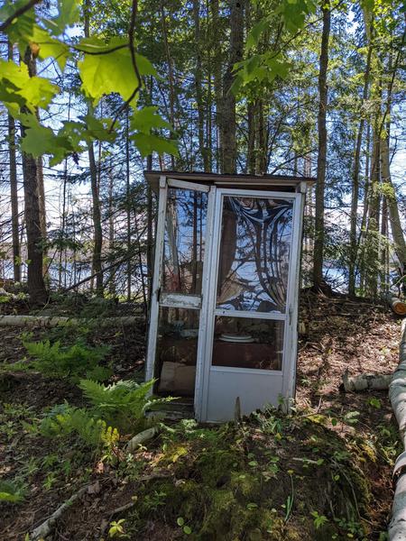Outhouse at the camp on Mitchell Lake. It has a nice view, but still, transparent floor to ceiling?