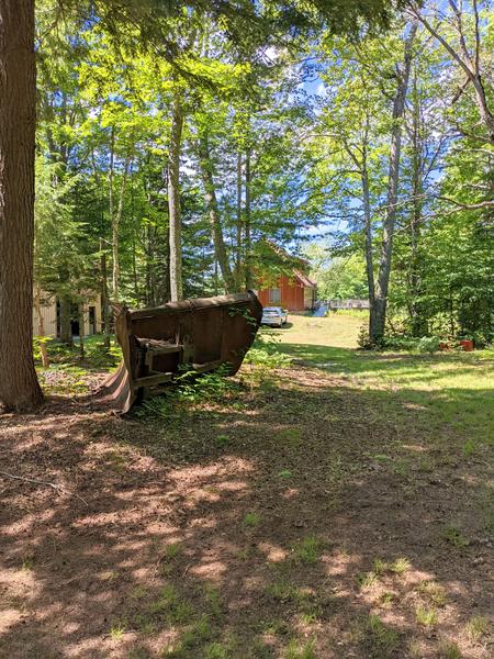 Camp on Kennedy Lake with a large, old snowplow.