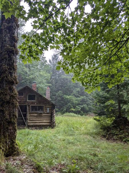 The Cabin as seen from the woodshed during heavy rain.