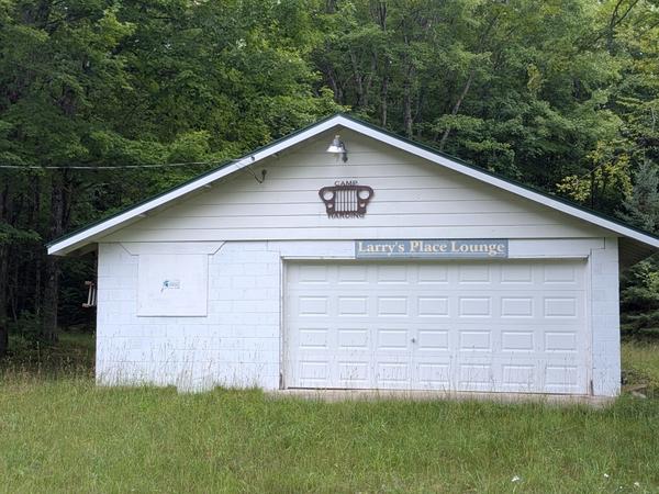 Sign for Camp Harding and Larry's Place Lounge(?)