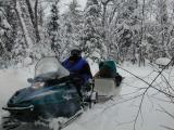 Jon on snowmobile with sleigh