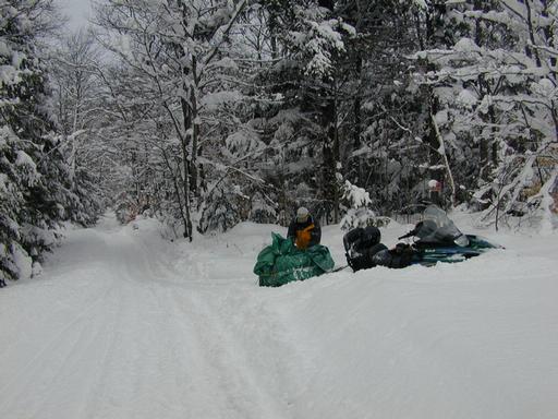 Matt unloading the snowshoes at the entrance to the cabin.