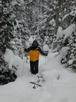 Matt snowshoeing in the woods.