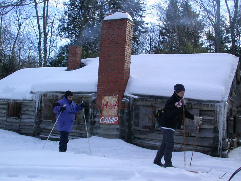 Amelia and Jon leaving the cabin to go skiing.