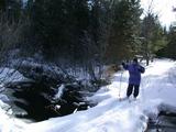 Jon skiing across a bridge.  Notice his fear.