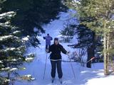 Jon skiing back across the bridge.