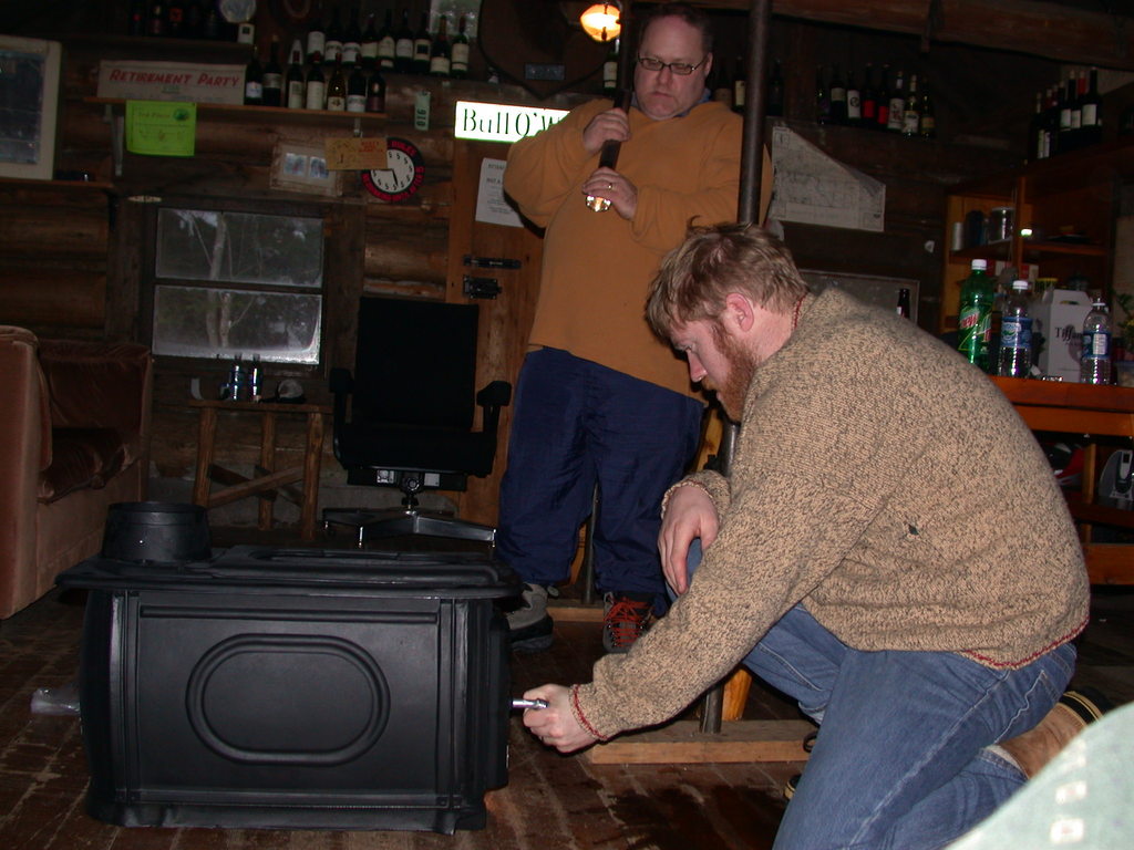 Jon and Bill putting together a new wood stove for the bunk room.