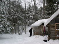 Bill and Scozi with the scenery around the cabin after the snowfall.