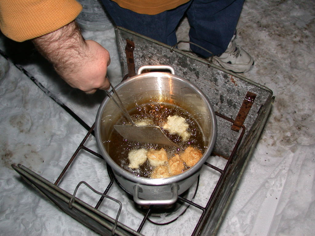 Jon frying donut.