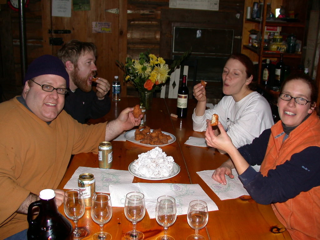 Jon, Bill, Vittoria, and Amelia eating donuts.