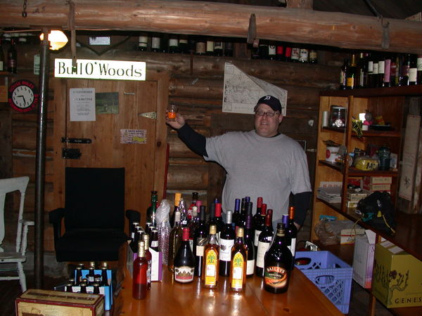 Jon toasting with Krupnik in front of our collection of
		  beverages for the trip.