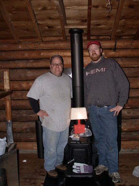 Bill and Jon after phase I of the wood stove
	     installation.