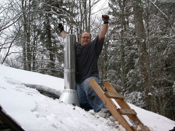 Jon after successfully installing the new chimney.
