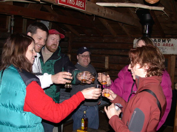 Vittoria, John, Bill, Jon, Katie, and Amelia toasting the
		  new stove.