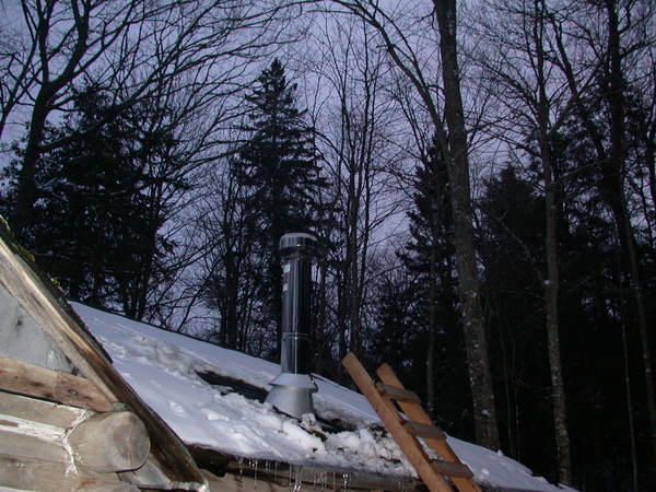 The chimney in use for the first time (no, you really
		  can't tell but there is smoke coming out).