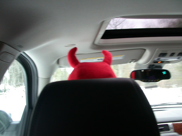 Jon driving to Pictured Rocks wearing his devil hat.