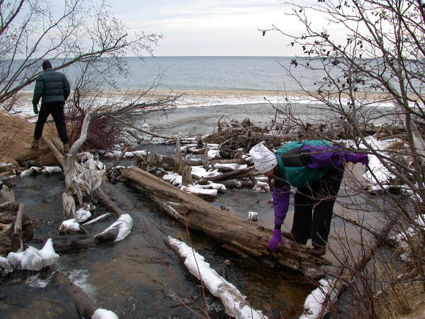 John and Vittoria crossing the river from the falls, near
		  Lake Superior.