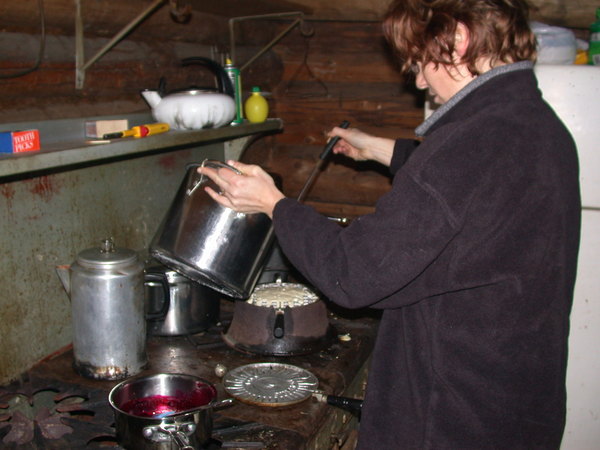 Amelia making waffles with the "new" waffle
		  iron.