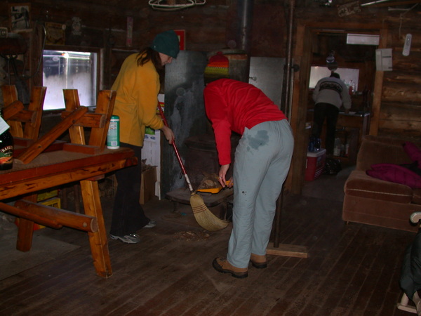 Vittoria and Katie cleaning in the main room. John
		  cleaning in the kitchen.