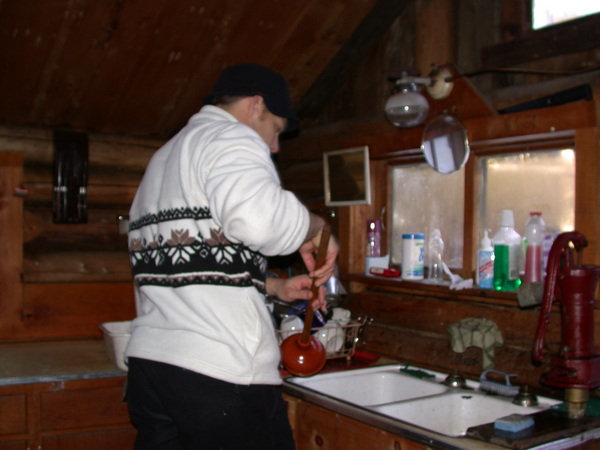 John cleaning in the kitchen.