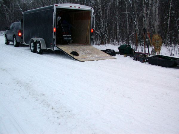 Unloading the trailer at the trailhead.  Notice there is
	   actually snow on the ground and it is actually light out!