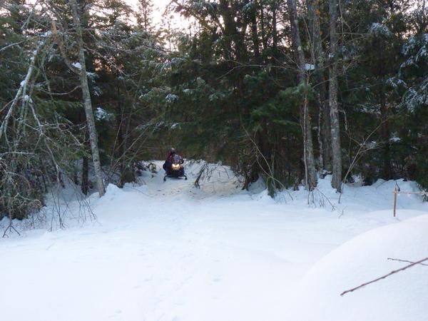 First arrival on snowmobile.