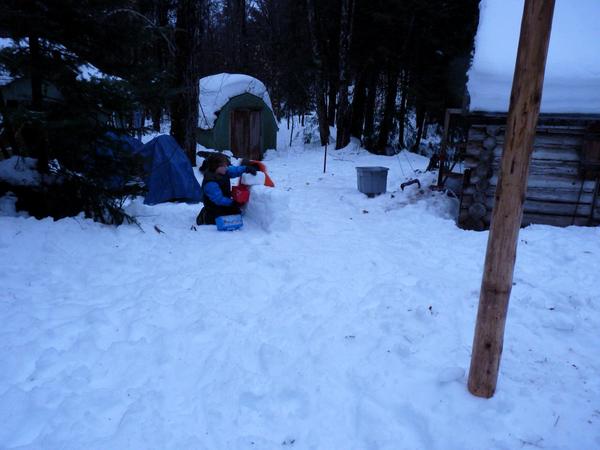 Frankie and Teddy building a snow wall.