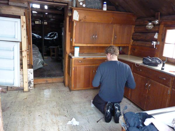 Bill doing his favorite task, cleaning the kitchen floor.