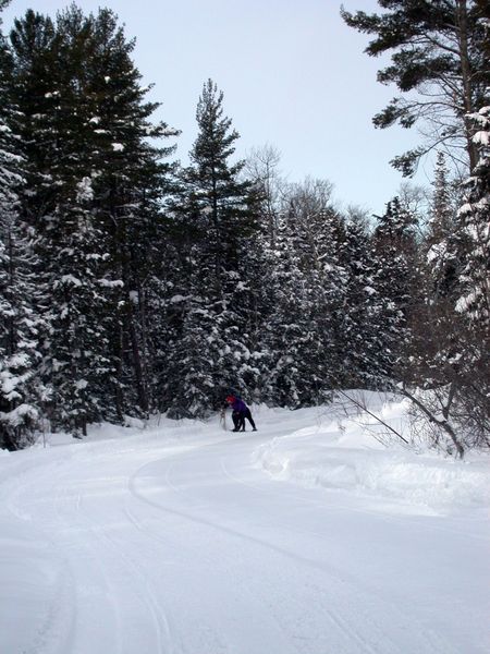 Snowshoeing along McCloud Grade.Amelia and Jon fixing snowshoes.