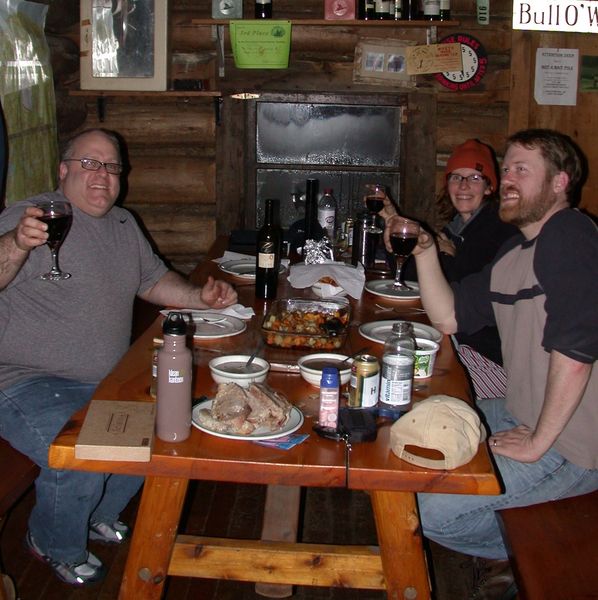 Jon, Bill, and Amelia sitting down to dinner.