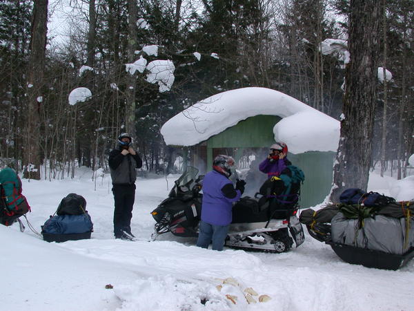 Bill, Jon, and Amelia preparing to leave with all the gear packed in the sleds.