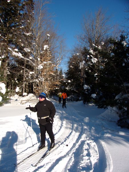 Jon, Ed, and Bill cross country skiing.