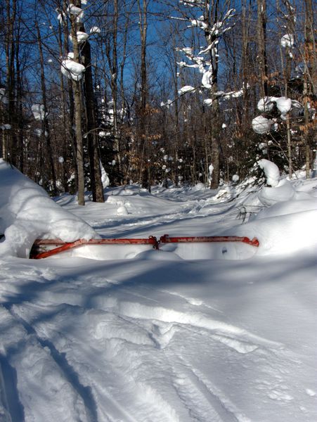 The gate along the road to Camp Oscar almost entirely buried in snow.