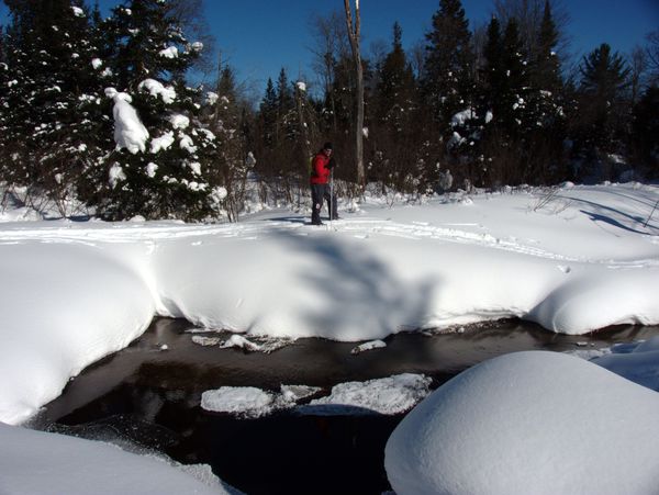 Paul skiing across the buried beaver dam.