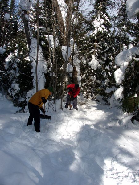 Doug and Paul making improvements to the toboggan run.